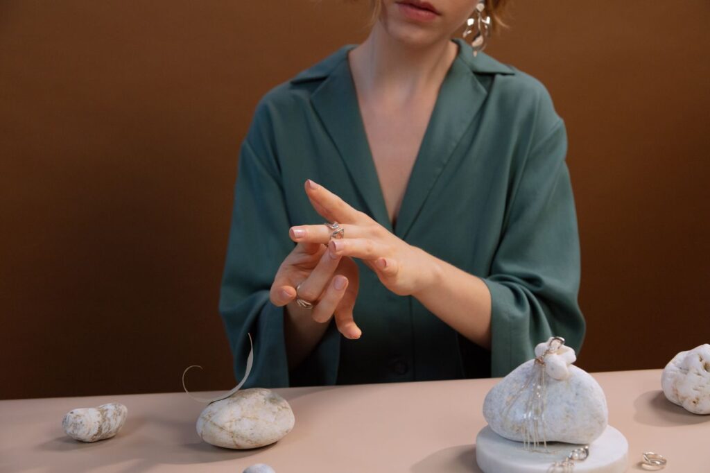 Woman trying a ring on her finger